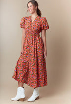 Ivonne midi Dress.                                       Vestido midi con cremallera frontal y estampado floral de transición