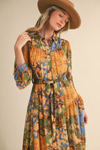 Vera midi Dress                                          Vestido midi abotonado con cinturón y estampado patchwork