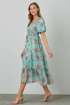 Cielo Dress                                               Vestido largo con manga de burbujas y estampado floral