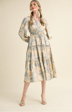 Lina midi Dress                                         

Vestido midi floral con ribete de volantes